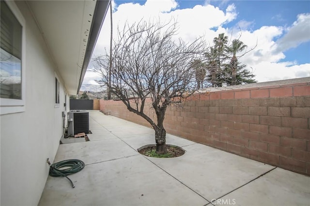 view of patio featuring central AC and a fenced backyard