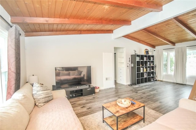 living area with lofted ceiling with beams, wood finished floors, and wood ceiling