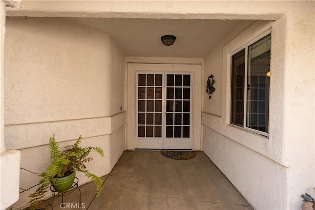 doorway to property with stucco siding