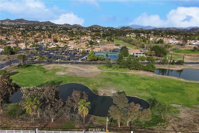 birds eye view of property featuring a water and mountain view