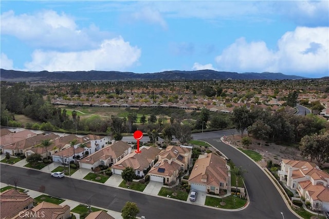 birds eye view of property featuring a mountain view and a residential view