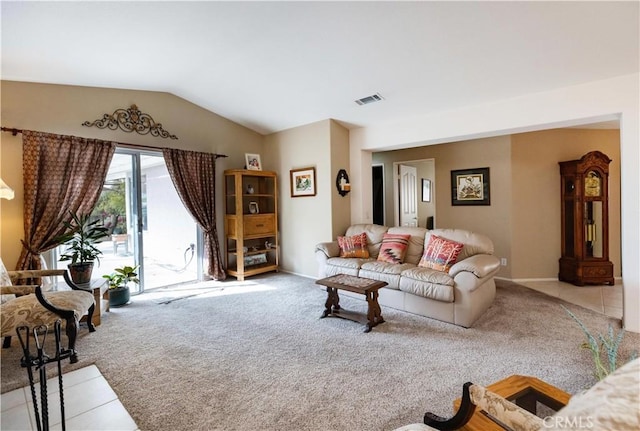 living area featuring carpet, visible vents, lofted ceiling, and baseboards