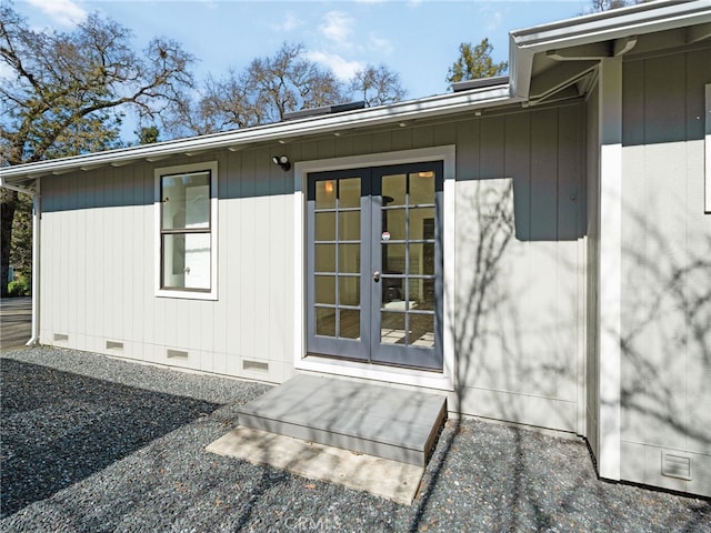 property entrance with french doors and crawl space