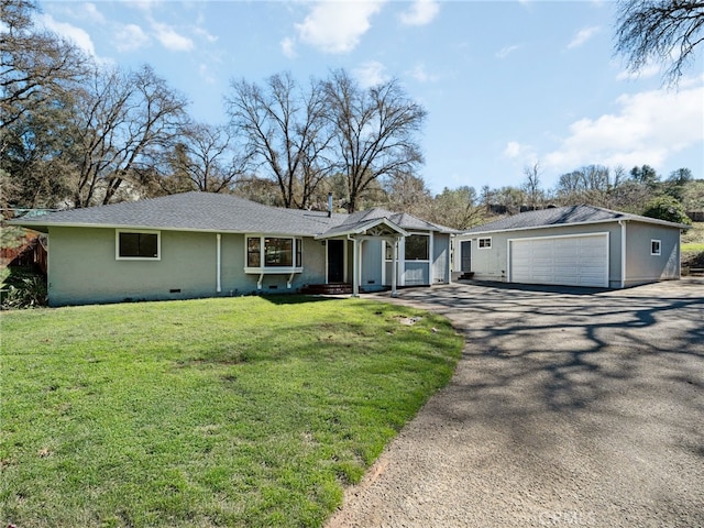 single story home with crawl space, aphalt driveway, a front lawn, and an outdoor structure