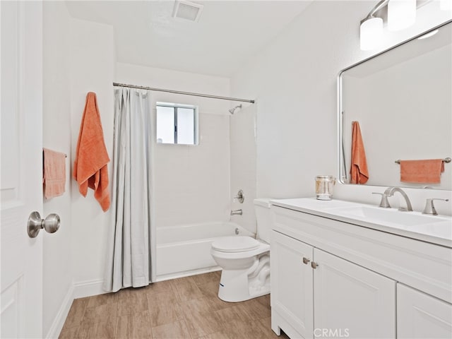 bathroom featuring shower / bathtub combination with curtain, visible vents, vanity, and toilet