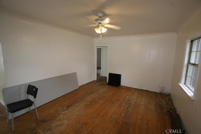 unfurnished room with ceiling fan and hardwood / wood-style flooring