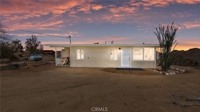 view of front of house featuring stucco siding