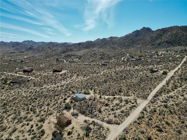 aerial view featuring view of desert and a mountain view