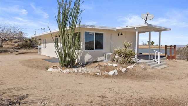 exterior space featuring stucco siding