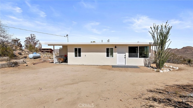 view of front of home featuring stucco siding