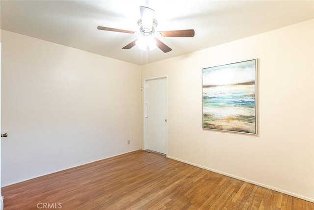 empty room with light wood-style flooring and a ceiling fan