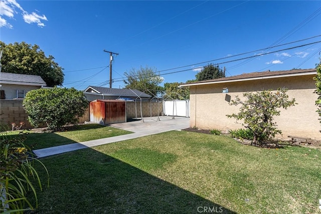 view of yard with a patio area and fence