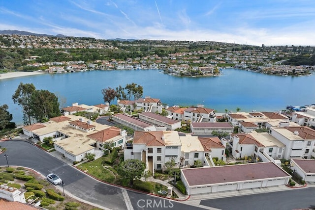 bird's eye view with a water view and a residential view