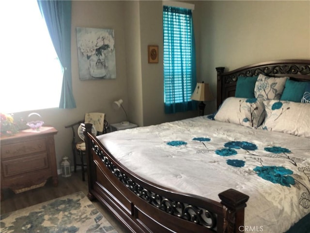 bedroom with wood finished floors