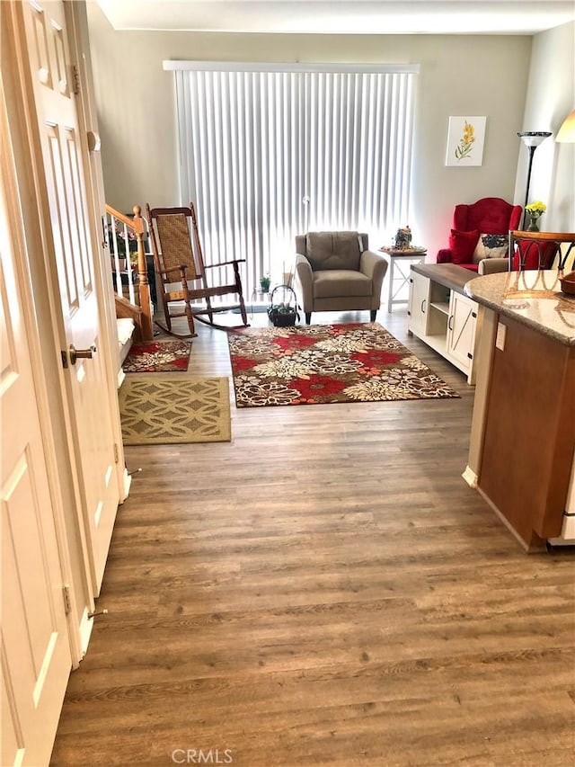 interior space featuring dark wood-style flooring and stairs