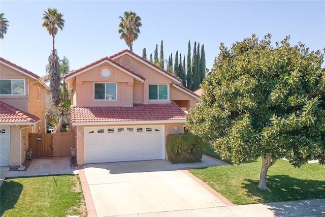 traditional home featuring a garage, fence, a tile roof, driveway, and stucco siding