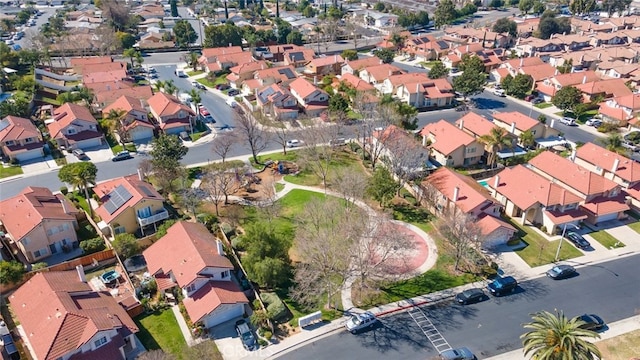 birds eye view of property with a residential view