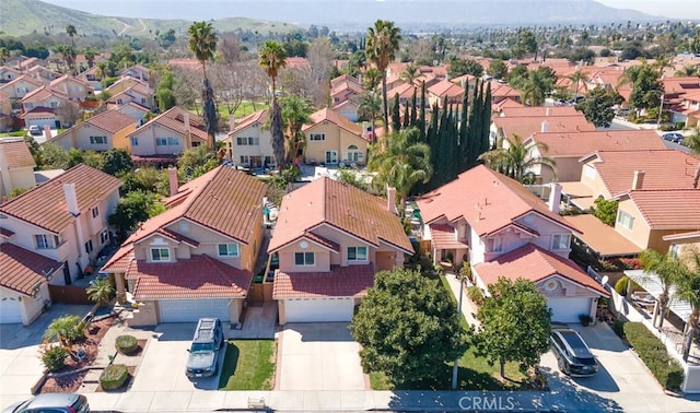 birds eye view of property with a residential view and a mountain view