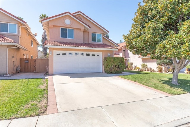 traditional-style home with driveway, a tiled roof, a front lawn, and stucco siding