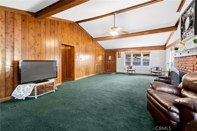 carpeted living room with wooden walls, ceiling fan, lofted ceiling with beams, and baseboards