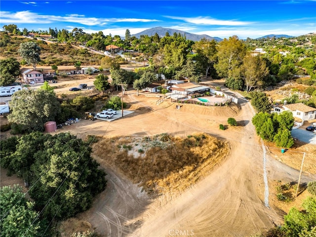 birds eye view of property featuring a mountain view