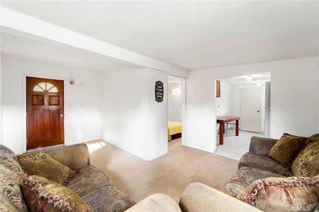 living room with baseboards and light colored carpet