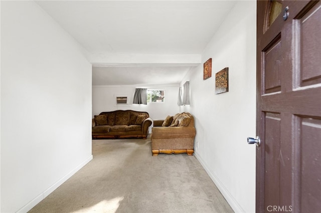 living room with light carpet and baseboards