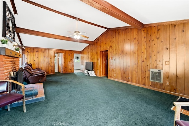 sitting room with lofted ceiling with beams, ceiling fan, wooden walls, carpet floors, and heating unit