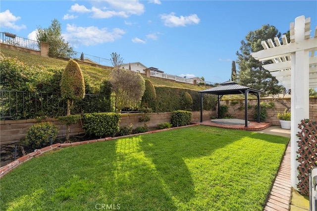 view of yard with a gazebo, a patio area, and a fenced backyard