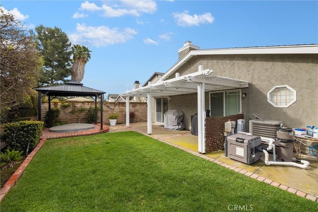 view of yard with a patio, a gazebo, central AC, fence, and a pergola