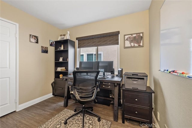 office with baseboards and wood finished floors