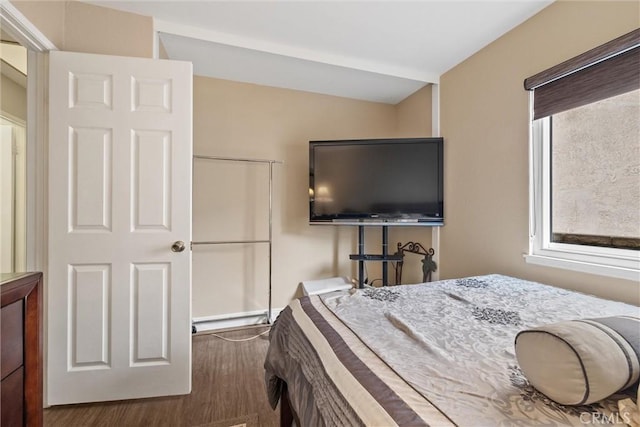 bedroom featuring dark wood-style floors