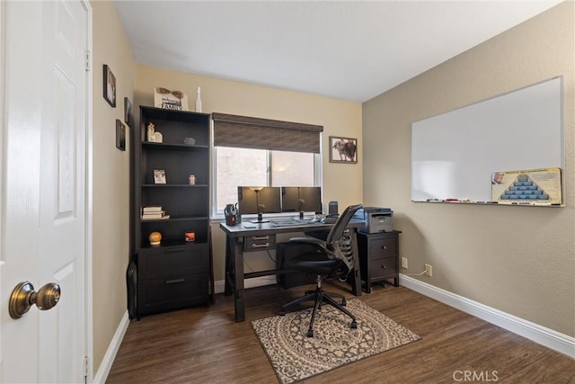 office area with baseboards and dark wood finished floors