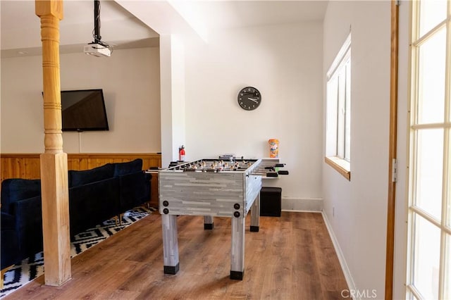 1075 Rivera Dr, Wrightwood, CA 92397 - game room with wood walls, baseboards, wood finished floors, and wainscoting