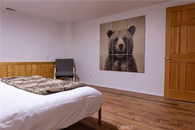 1075 Rivera Dr, Wrightwood, CA 92397 - bedroom with visible vents, baseboards, and wood finished floors