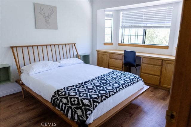 1075 Rivera Dr, Wrightwood, CA 92397 - bedroom featuring dark wood-style flooring and built in study area