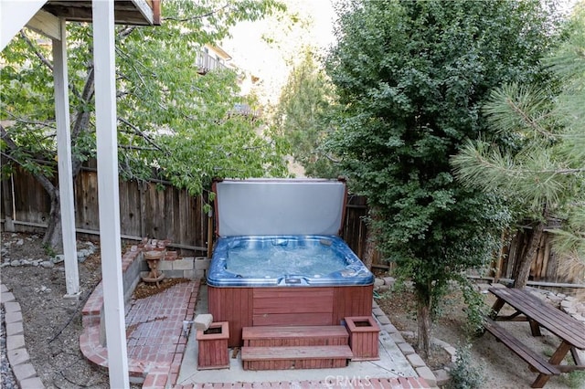 1075 Rivera Dr, Wrightwood, CA 92397 - exterior space with a patio area, a hot tub, and a fenced backyard