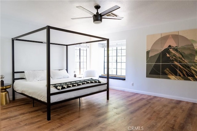 1075 Rivera Dr, Wrightwood, CA 92397 - bedroom with ceiling fan, baseboards, and wood finished floors