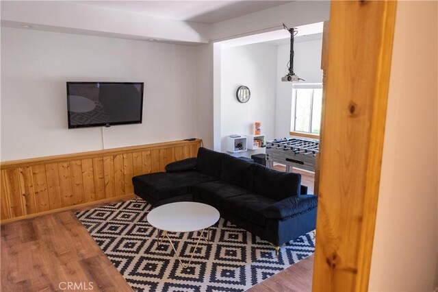 1075 Rivera Dr, Wrightwood, CA 92397 - living room with wainscoting, wood finished floors, and wooden walls