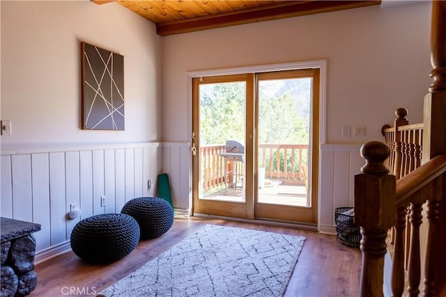 1075 Rivera Dr, Wrightwood, CA 92397 - doorway to outside featuring wood ceiling, a wainscoted wall, and wood finished floors