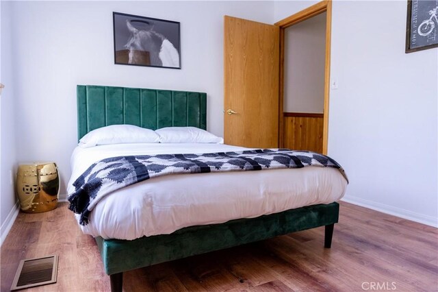 1075 Rivera Dr, Wrightwood, CA 92397 - bedroom featuring baseboards, visible vents, and wood finished floors