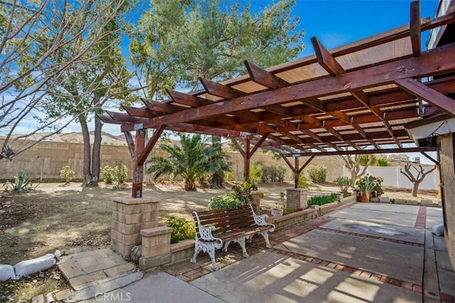 view of patio featuring fence private yard and a pergola