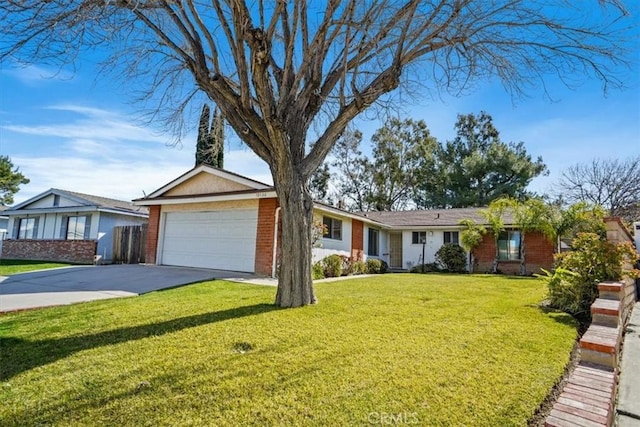 ranch-style house featuring a front lawn, brick siding, driveway, and an attached garage