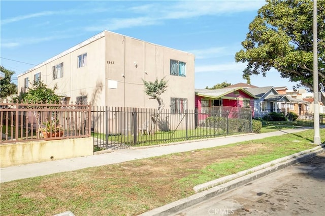 view of property featuring a fenced front yard and a residential view