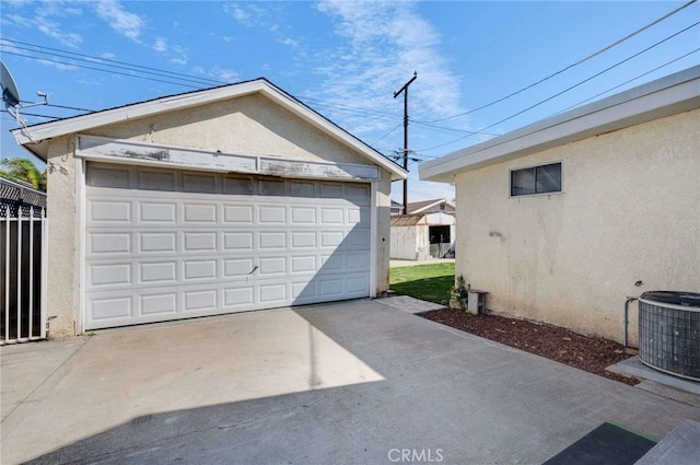 detached garage featuring central air condition unit