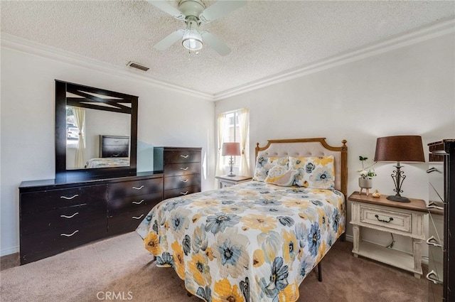 bedroom featuring carpet floors, visible vents, a textured ceiling, and ornamental molding