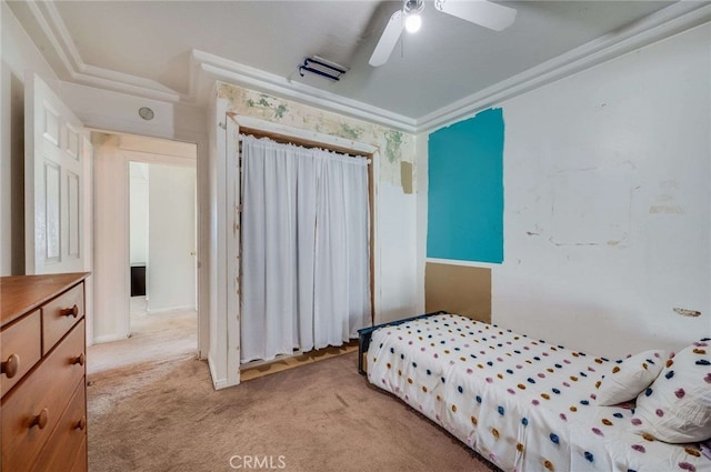 bedroom with ornamental molding, light colored carpet, and ceiling fan