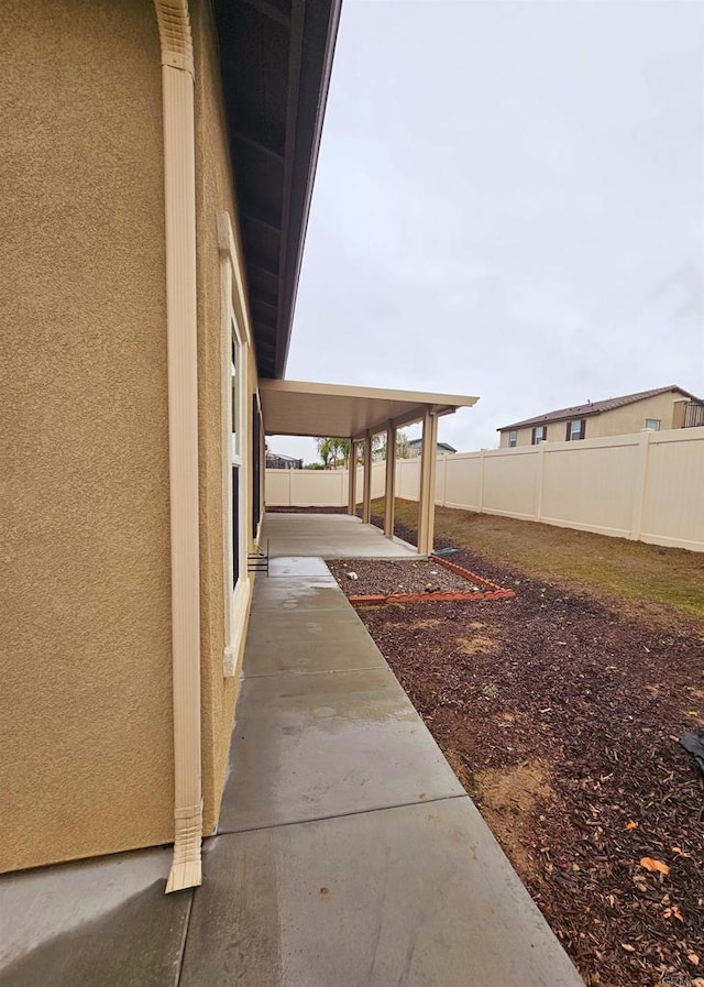 view of yard with a patio and fence