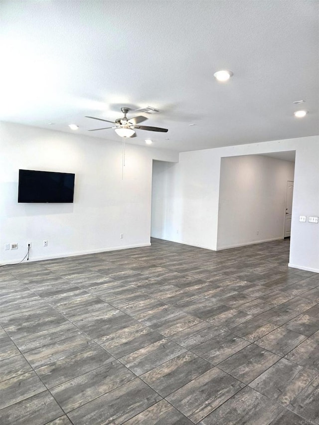 unfurnished room with recessed lighting, a ceiling fan, and baseboards