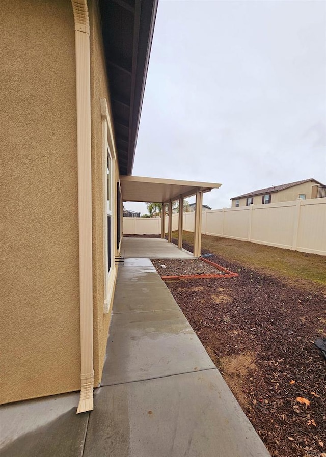 view of yard with a fenced backyard and a patio area